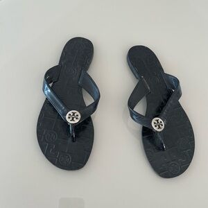 Tory Burch Black Flip-Flops with Silver Emblem